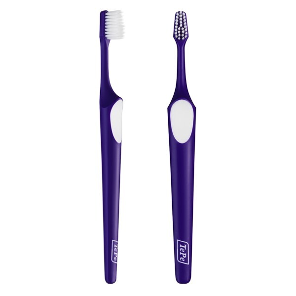 Two TePe Supreme Compact Toothbrushes in purple color with a white diamond-shaped bristle pattern on the brush head.