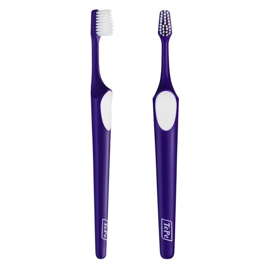 Two TePe Supreme Compact Toothbrushes in purple color with a white diamond-shaped bristle pattern on the brush head.